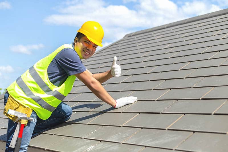 Builder Working On Roof Of New Building, Construction Worker Wea